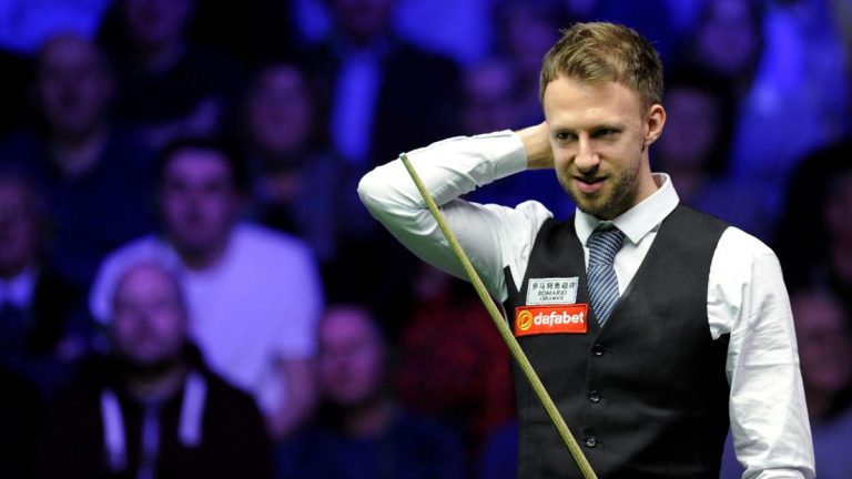 In the 2024 World Grand Prix, Judd Trump easily defeats Mark Selby to advance into the semi-finals